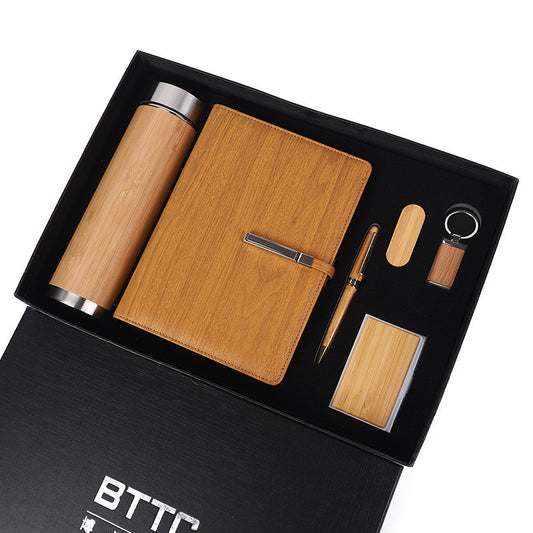 Wooden stationery gift set with notebook, pen, keychain, and business card holder