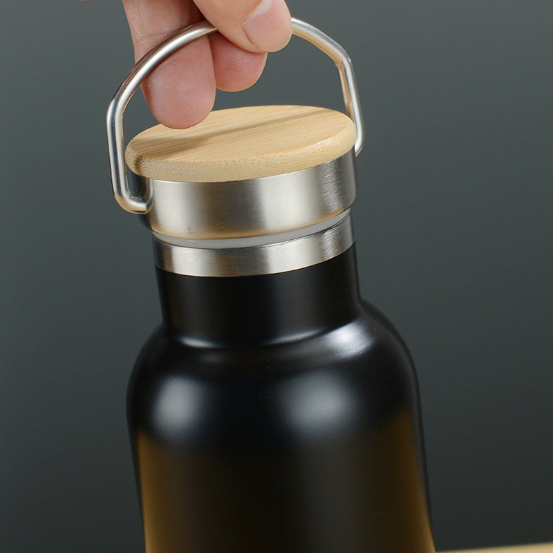 stainless_steel_water_bottle with wooden cap